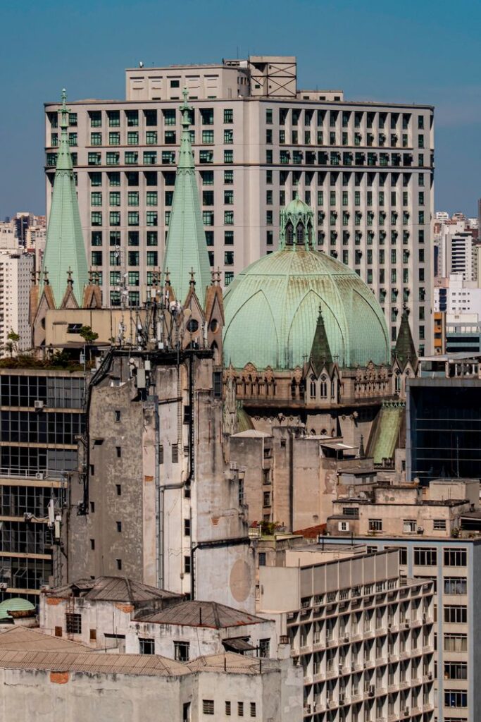 A vibrant view of São Paulo's iconic cathedral and surrounding urban architecture.