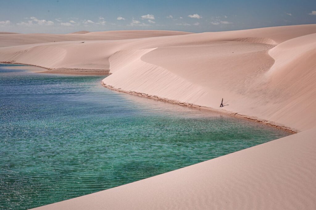 Santo Amaro Brazil Experience the stunning beauty of Lençóis Maranhenses with pristine sand dunes and a turquoise lagoon.